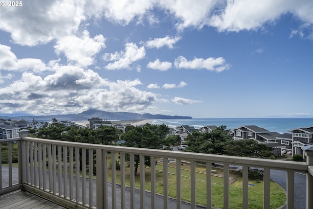 balcony featuring a water view and a residential view