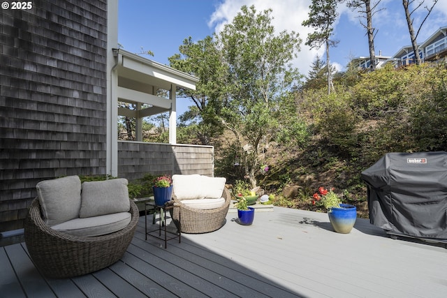 wooden deck with grilling area