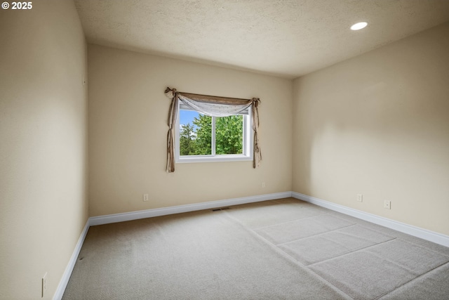 12033 S Shadow Hills Ct, Turner, OR 97392 - unfurnished room with carpet flooring, baseboards, recessed lighting, and a textured ceiling