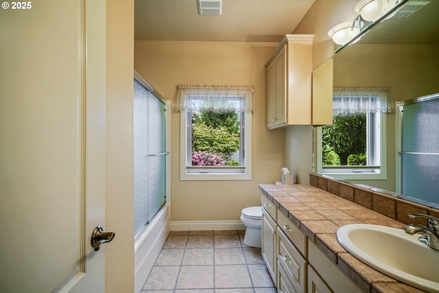 12033 S Shadow Hills Ct, Turner, OR 97392 - bathroom with vanity, healthy amount of natural light, toilet, and baseboards