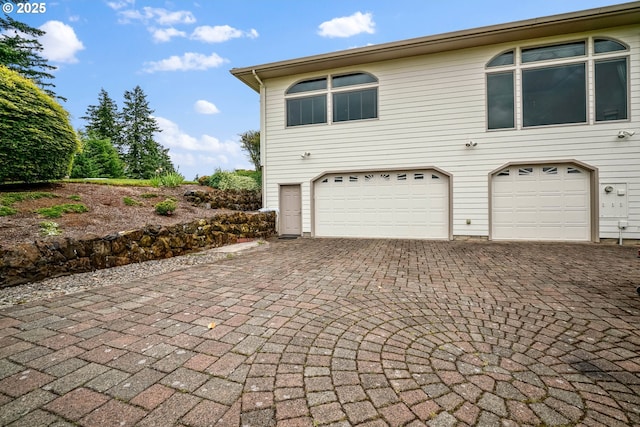 12033 S Shadow Hills Ct, Turner, OR 97392 - view of property exterior featuring a garage and decorative driveway