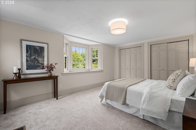2815 NE 35th Ave, Portland, OR 97212 - carpeted bedroom with multiple closets and baseboards