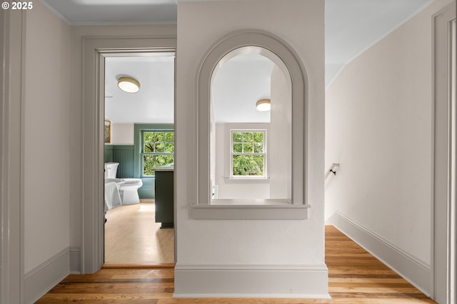 2815 NE 35th Ave, Portland, OR 97212 - hall with wood finished floors, arched walkways, crown molding, and baseboards