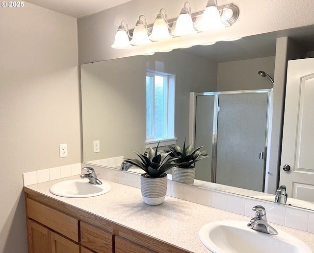 bathroom featuring vanity and an enclosed shower