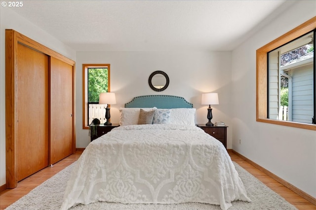 115 Willow St, Silverton, OR 97381 - bedroom with light wood-style flooring and a closet