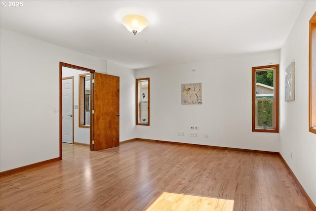 115 Willow St, Silverton, OR 97381 - empty room with light wood-style flooring and baseboards