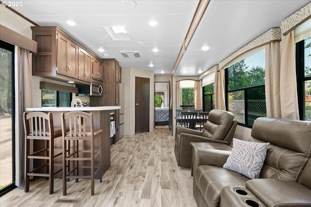 115 Willow St, Silverton, OR 97381 - living room featuring light wood-style floors and recessed lighting