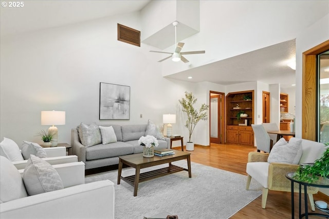 115 Willow St, Silverton, OR 97381 - living area with light wood-style floors, ceiling fan, and high vaulted ceiling