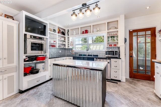 kitchen featuring a sink, open shelves, white cabinets, and stainless steel appliances