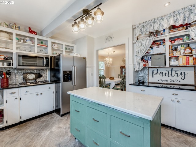 kitchen with open shelves, appliances with stainless steel finishes, white cabinetry, backsplash, and a chandelier