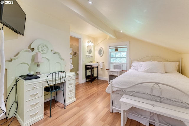 bedroom with light wood-type flooring, lofted ceiling with beams, and baseboards