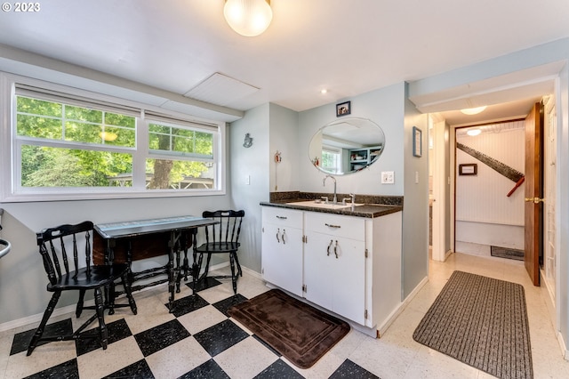 bathroom with vanity, tile patterned floors, and baseboards