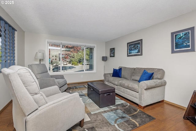5355 SW 205th Ct, Beaverton, OR 97078 - living room featuring wood finished floors, a textured ceiling, and baseboards
