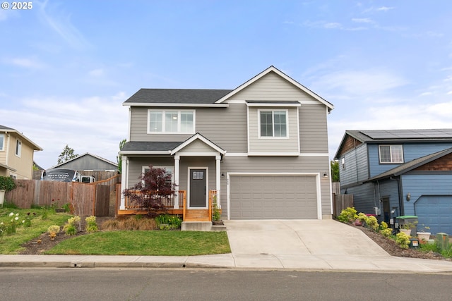 844 N Grant St, Lafayette, OR 97127 - view of front facade featuring a garage, driveway, covered porch, and a shingled roof