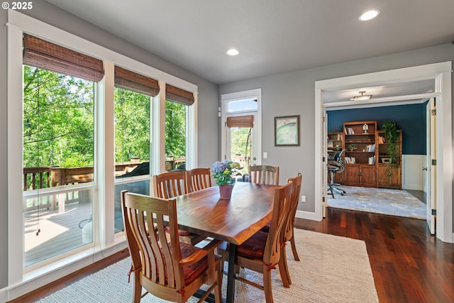 dining area with dark wood finished floors, recessed lighting, and baseboards