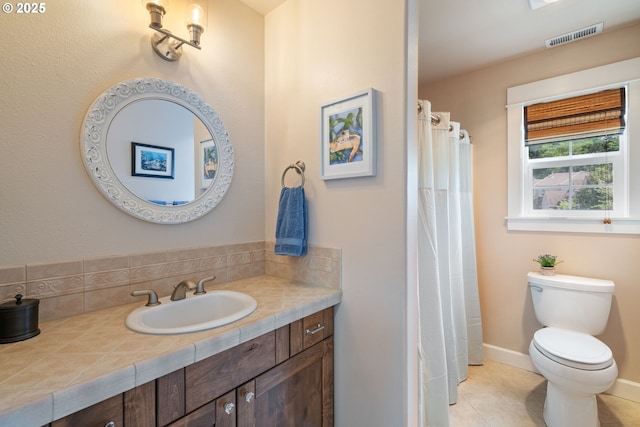 3023 NW Spencer St, Portland, OR 97229 - bathroom with vanity, tile patterned floors, and tasteful backsplash