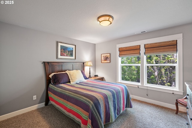 bedroom with carpet floors and baseboards