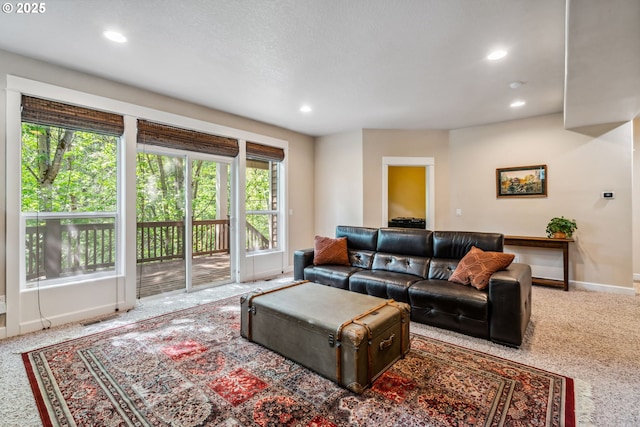 living room featuring healthy amount of natural light, recessed lighting, baseboards, and carpet flooring