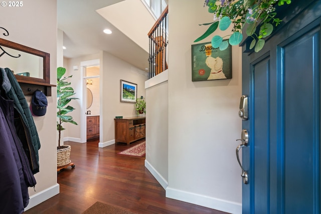 entryway featuring dark wood-type flooring, baseboards, and recessed lighting