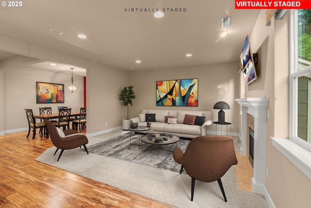 1043 Meek Way W, Linn, OR 97068 - living room with recessed lighting, baseboards, a fireplace, and light wood finished floors
