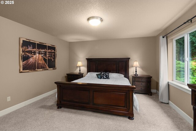 1043 Meek Way W, Linn, OR 97068 - bedroom featuring light colored carpet, a textured ceiling, and baseboards