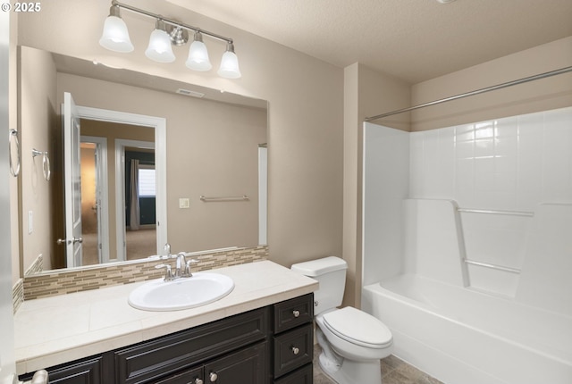 full bathroom with visible vents, tasteful backsplash, vanity, toilet, and shower / bathtub combination