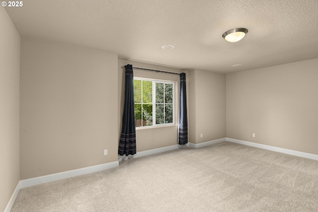 1043 Meek Way W, Linn, OR 97068 - spare room featuring light colored carpet, a textured ceiling, and baseboards
