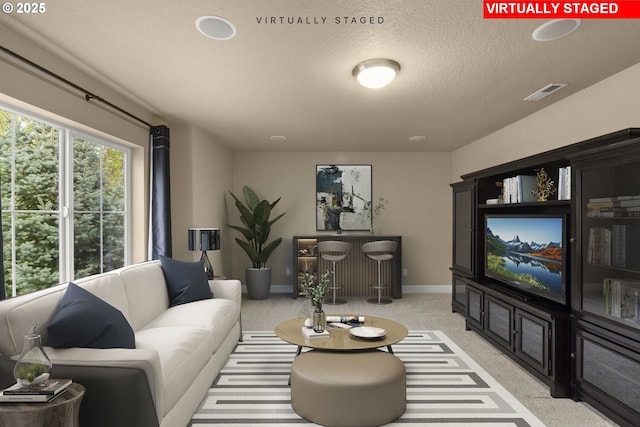 1043 Meek Way W, Linn, OR 97068 - living room featuring light carpet, a textured ceiling, and baseboards