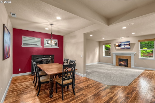 1043 Meek Way W, Linn, OR 97068 - dining space with wood finished floors, recessed lighting, a tiled fireplace, baseboards, and a chandelier