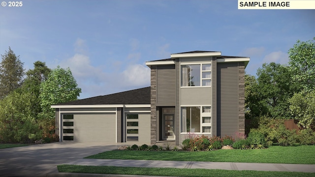 modern home featuring driveway, an attached garage, fence, and a front yard