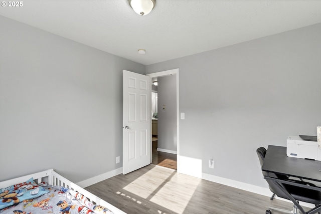 bedroom featuring dark hardwood / wood-style flooring