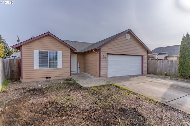 ranch-style home featuring a garage