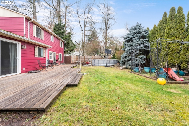 view of yard featuring a swimming pool side deck