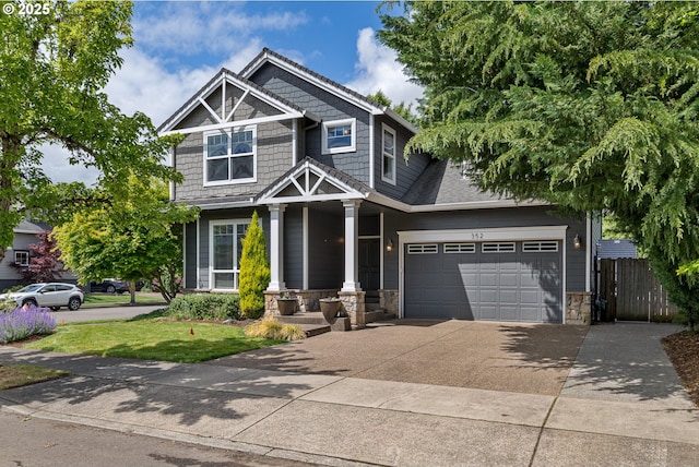 352 SE 14th Pl, Canby, OR 97013 - craftsman house featuring driveway, stone siding, an attached garage, and a porch
