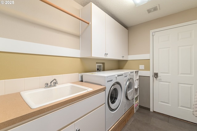 352 SE 14th Pl, Canby, OR 97013 - laundry room with cabinet space, independent washer and dryer, and dark tile patterned flooring