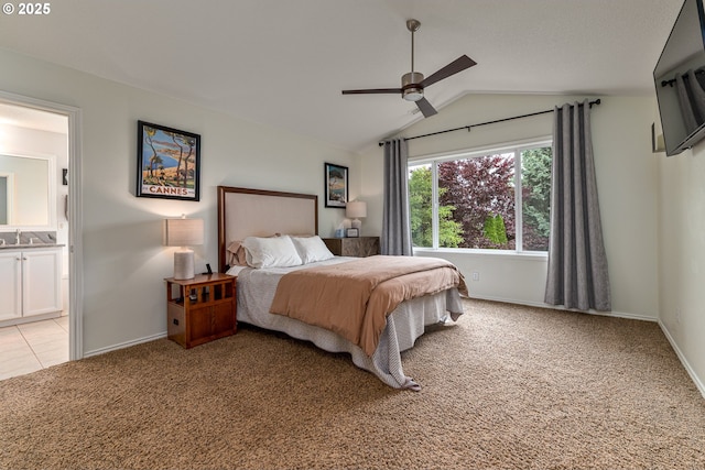 352 SE 14th Pl, Canby, OR 97013 - bedroom featuring light colored carpet, lofted ceiling, baseboards, a sink, and ensuite bath