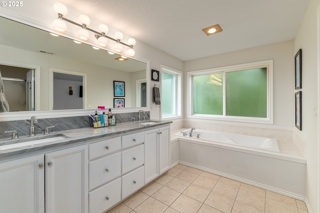 352 SE 14th Pl, Canby, OR 97013 - full bathroom with double vanity, a bath, and tile patterned flooring