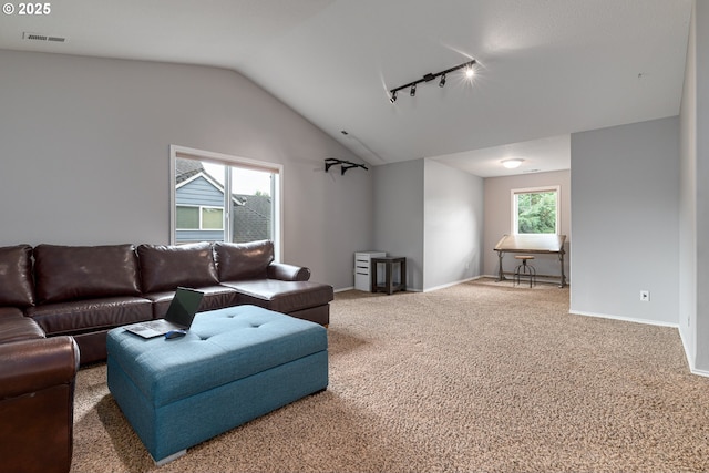 352 SE 14th Pl, Canby, OR 97013 - carpeted living area with lofted ceiling, rail lighting, and baseboards