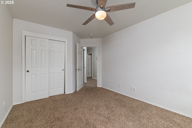 352 SE 14th Pl, Canby, OR 97013 - unfurnished bedroom featuring a closet, carpet floors, baseboards, a textured ceiling, and a ceiling fan