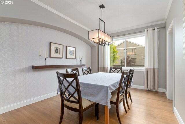 352 SE 14th Pl, Canby, OR 97013 - dining area featuring light wood-style flooring, ornamental molding, a chandelier, and baseboards