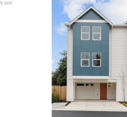 15091 SE Division St, Portland, OR 97236 - view of front facade featuring driveway, a garage, and fence