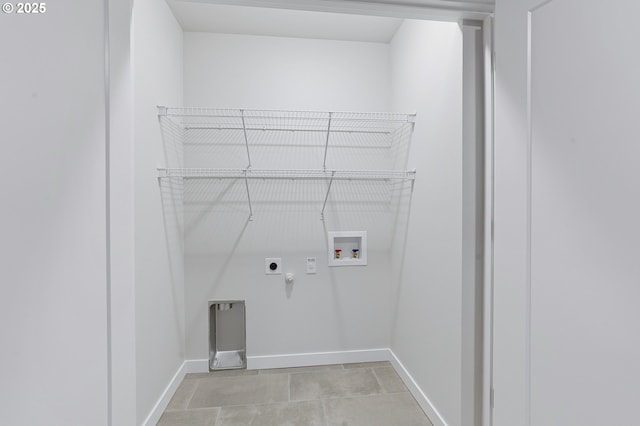 15091 SE Division St, Portland, OR 97236 - washroom featuring gas dryer hookup, electric dryer hookup, hookup for a washing machine, baseboards, and light tile patterned floors