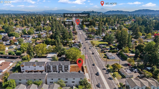 15091 SE Division St, Portland, OR 97236 - aerial overview of property's location with a mountain backdrop and nearby suburban area