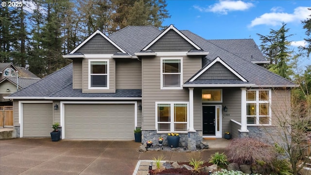 craftsman-style home with driveway, stone siding, and roof with shingles