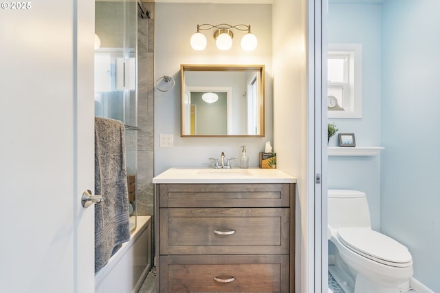 bathroom featuring toilet, washtub / shower combination, and vanity