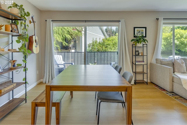 6825 SW Capitol Hill Rd Unit 27, Portland, OR 97219 - dining space featuring healthy amount of natural light and light wood-style flooring