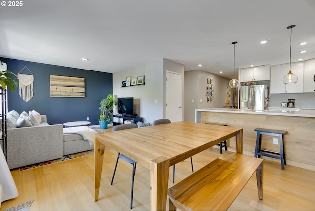 6825 SW Capitol Hill Rd Unit 27, Portland, OR 97219 - dining area with light wood-style flooring and recessed lighting