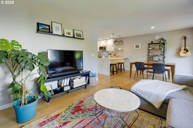 6825 SW Capitol Hill Rd Unit 27, Portland, OR 97219 - living room featuring light wood-type flooring and recessed lighting