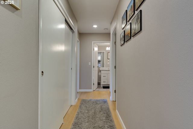 6825 SW Capitol Hill Rd Unit 27, Portland, OR 97219 - hallway featuring light wood-type flooring and recessed lighting
