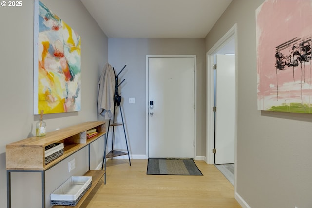 6825 SW Capitol Hill Rd Unit 27, Portland, OR 97219 - foyer entrance with light wood finished floors and baseboards